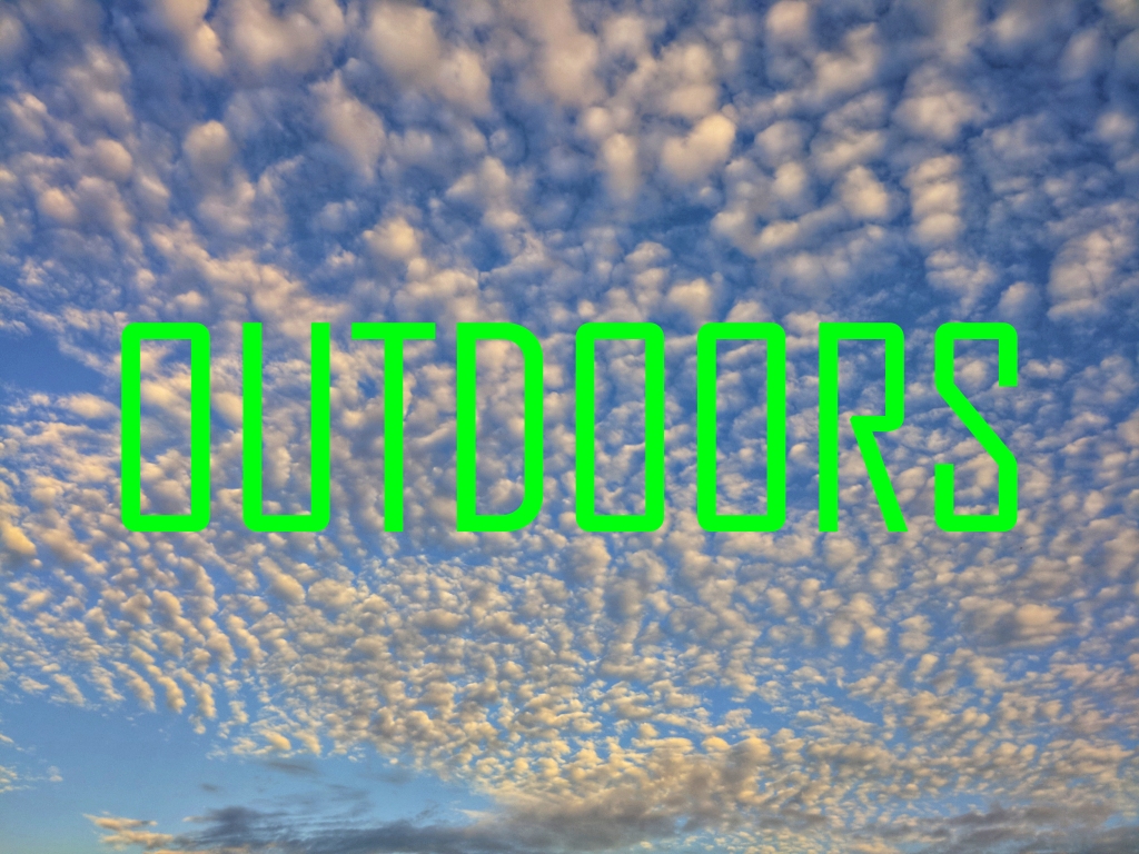A photo of clouds against a blue sky with green lettering across it that reads "OUTDOORS".

Click through for more OUTDOORS photos